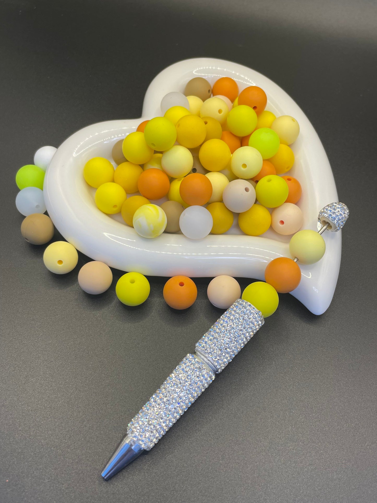 Bright yellow silicone beads with various colors to mix and match