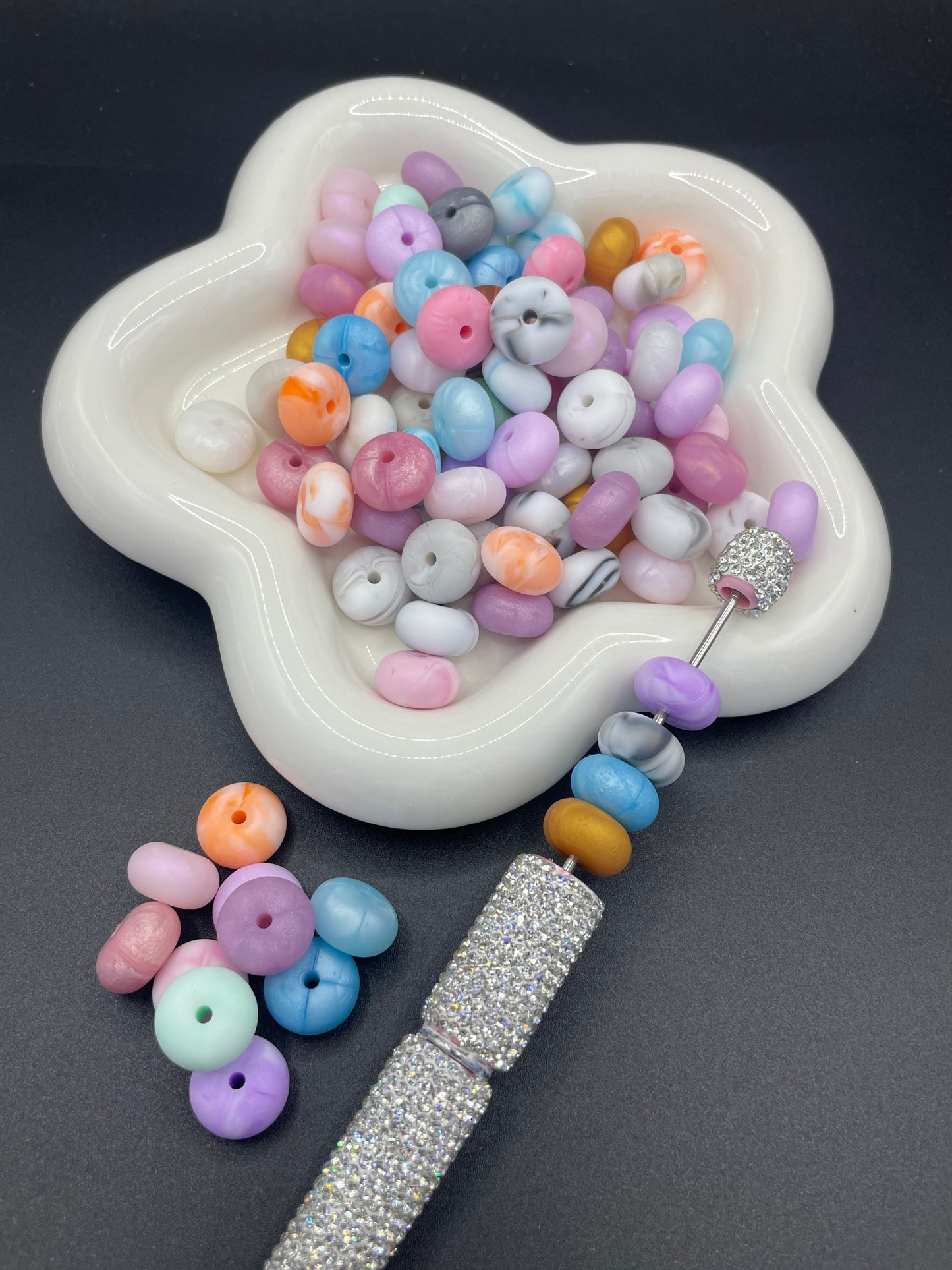 Small flat silicone beads in a variety of colors randomly mixed