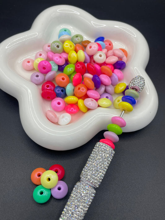 Flat silicone beads in a variety of bright colors randomly mixed